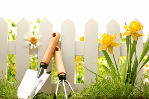 A gardener working carefully with safe access and clear surroundings